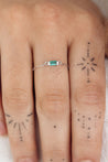 white gold small link ring with emerald charm